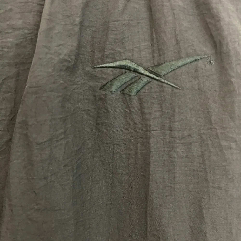 Men’s Vintage Reebok Nylon ankle zip track pants.